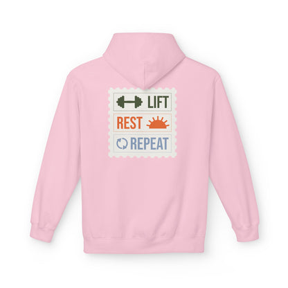 Light Pink hoodie with motivational text on the back against a white background